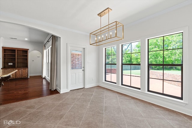 106 Horseguards Ave, Bossier City, LA 71111 - unfurnished dining area featuring visible vents, arched walkways, tile patterned flooring, baseboards, and ornamental molding
