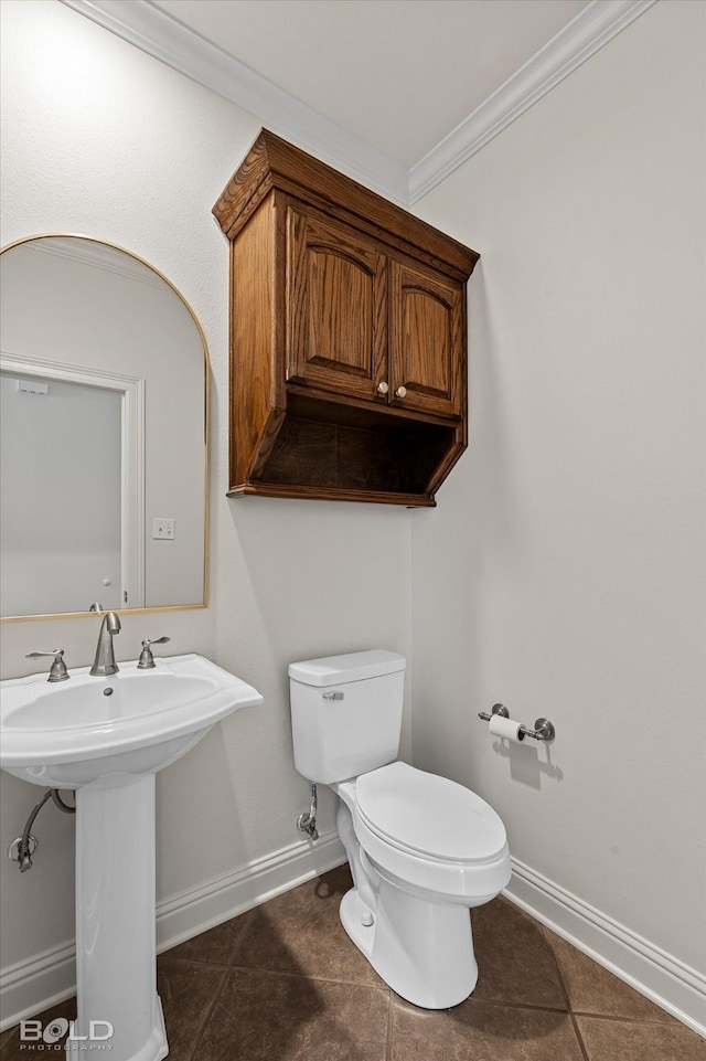 106 Horseguards Ave, Bossier City, LA 71111 - half bathroom featuring crown molding, tile patterned flooring, toilet, baseboards, and a sink