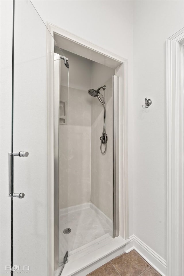 106 Horseguards Ave, Bossier City, LA 71111 - full bathroom featuring tile patterned flooring, baseboards, and a shower stall