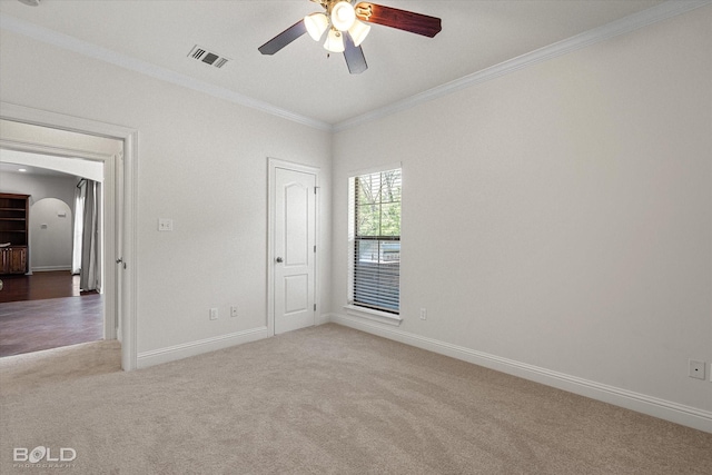 106 Horseguards Ave, Bossier City, LA 71111 - spare room with visible vents, crown molding, carpet floors, baseboards, and ceiling fan