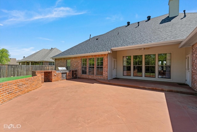 106 Horseguards Ave, Bossier City, LA 71111 - view of patio / terrace with exterior kitchen, ceiling fan, and fence