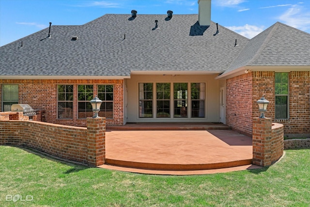 106 Horseguards Ave, Bossier City, LA 71111 - rear view of property featuring a chimney, exterior kitchen, a patio area, brick siding, and a shingled roof