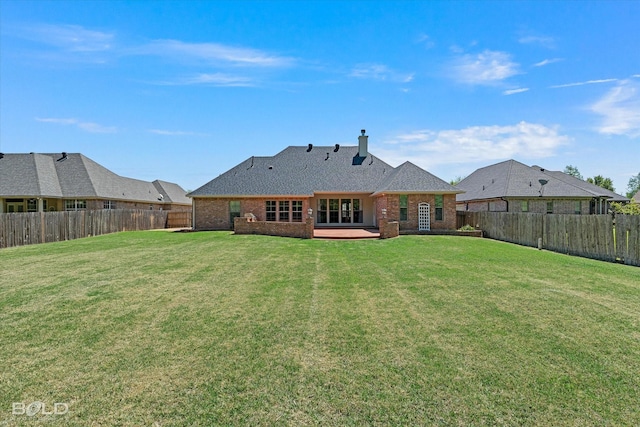 106 Horseguards Ave, Bossier City, LA 71111 - back of property with a lawn, brick siding, a chimney, and a fenced backyard