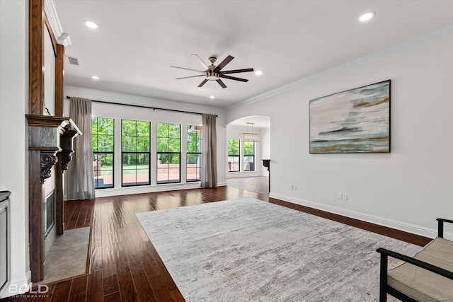 106 Horseguards Ave, Bossier City, LA 71111 - living area featuring visible vents, a ceiling fan, ornamental molding, arched walkways, and a premium fireplace