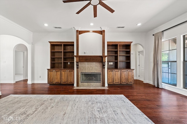 106 Horseguards Ave, Bossier City, LA 71111 - unfurnished living room featuring a ceiling fan, arched walkways, visible vents, and dark wood-style floors