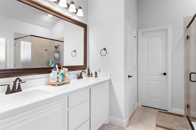 3918 Holly Springs Ln, Kaufman, TX 75142 - bathroom with tile patterned floors, double vanity, a sink, and a stall shower