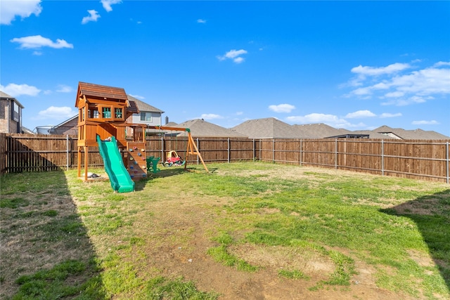 3918 Holly Springs Ln, Kaufman, TX 75142 - view of yard featuring a fenced backyard and a playground
