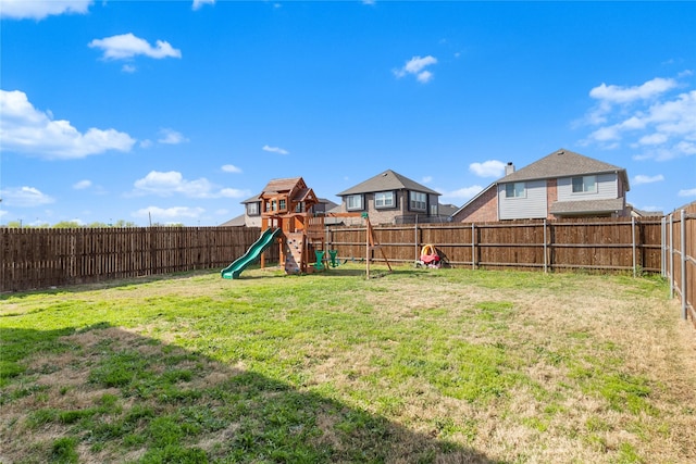 3918 Holly Springs Ln, Kaufman, TX 75142 - view of yard with a fenced backyard and a playground