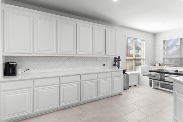 3918 Holly Springs Ln, Kaufman, TX 75142 - kitchen featuring tasteful backsplash, baseboards, white cabinetry, light countertops, and light tile patterned flooring