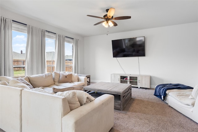 3918 Holly Springs Ln, Kaufman, TX 75142 - carpeted living area featuring baseboards and a ceiling fan