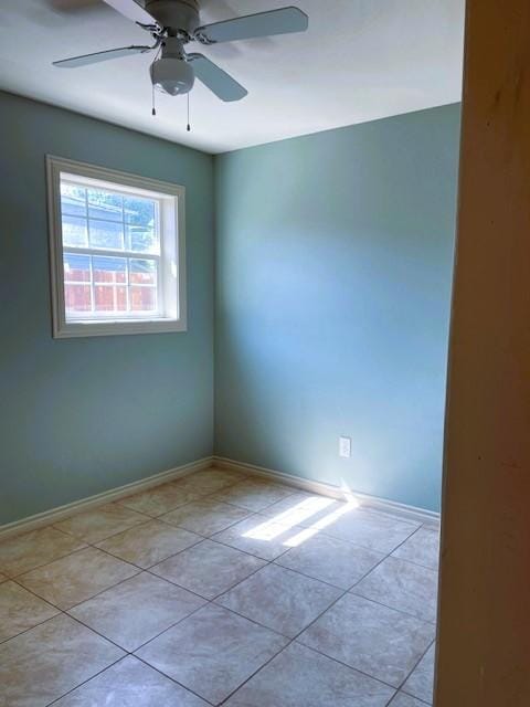 3915 Mather Ct, Dallas, TX 75211 - tiled spare room with baseboards and a ceiling fan