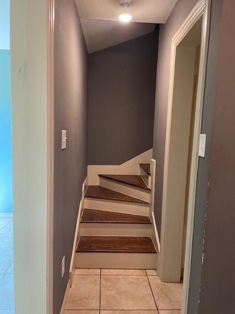 3915 Mather Ct, Dallas, TX 75211 - stairway with tile patterned flooring and baseboards