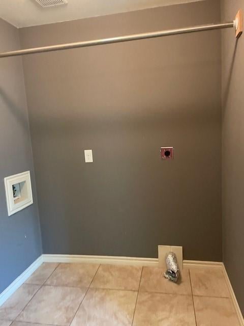 3915 Mather Ct, Dallas, TX 75211 - laundry room with electric dryer hookup, washer hookup, light tile patterned floors, and baseboards