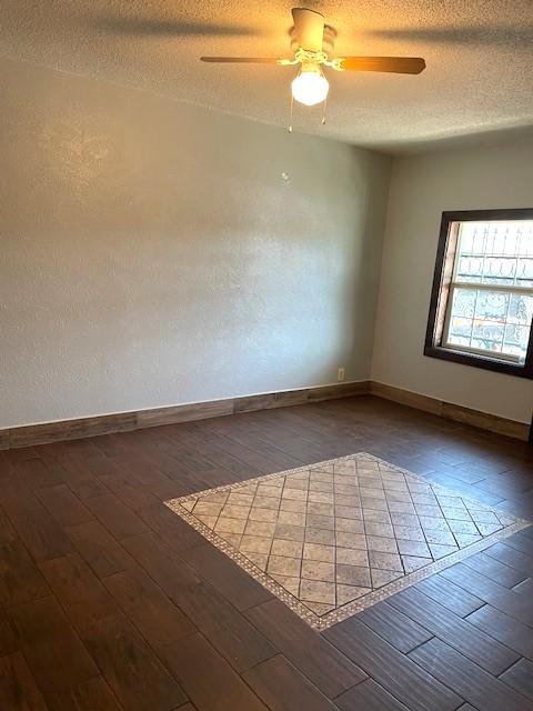 3915 Mather Ct, Dallas, TX 75211 - spare room featuring hardwood / wood-style flooring, a ceiling fan, baseboards, and a textured ceiling