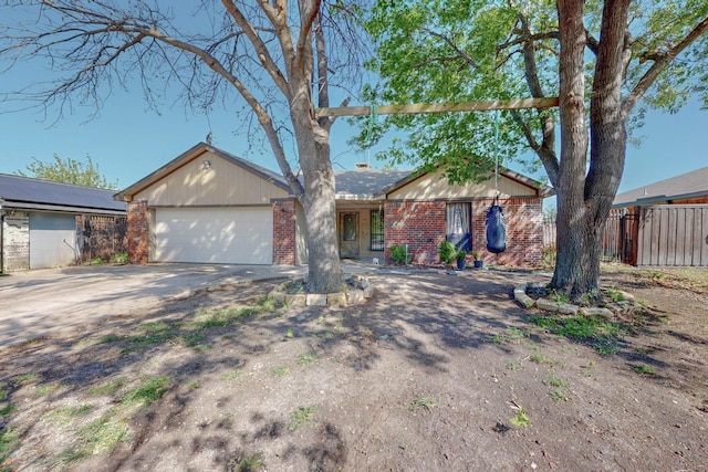 1310 Belinda Ct, Garland, TX 75040 - ranch-style home featuring brick siding, driveway, fence, and an attached garage
