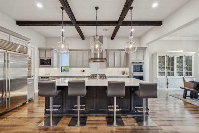 781 Star Meadow Dr, Prosper, TX 75078 - kitchen with dark wood finished floors, visible vents, appliances with stainless steel finishes, light countertops, and decorative backsplash