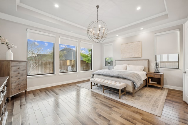 781 Star Meadow Dr, Prosper, TX 75078 - bedroom featuring a tray ceiling, wood-type flooring, a notable chandelier, and recessed lighting