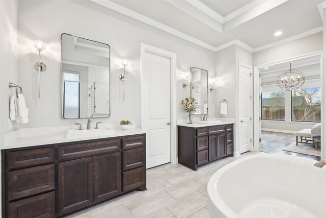 781 Star Meadow Dr, Prosper, TX 75078 - full bathroom featuring two vanities, a notable chandelier, a sink, and a washtub