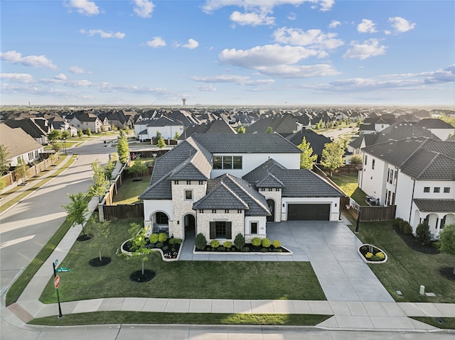781 Star Meadow Dr, Prosper, TX 75078 - view of front facade featuring stone siding, a garage, fence, a residential view, and driveway