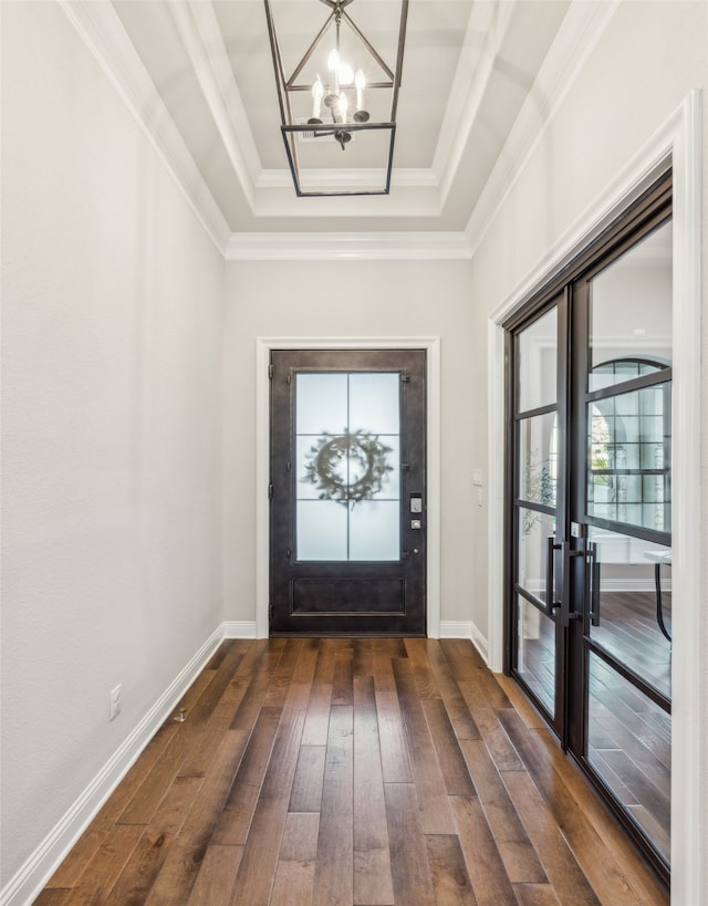 781 Star Meadow Dr, Prosper, TX 75078 - foyer featuring dark wood-style flooring, baseboards, an inviting chandelier, ornamental molding, and a raised ceiling
