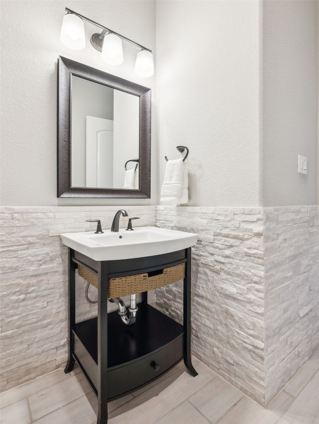 781 Star Meadow Dr, Prosper, TX 75078 - bathroom with vanity, wainscoting, and tile walls