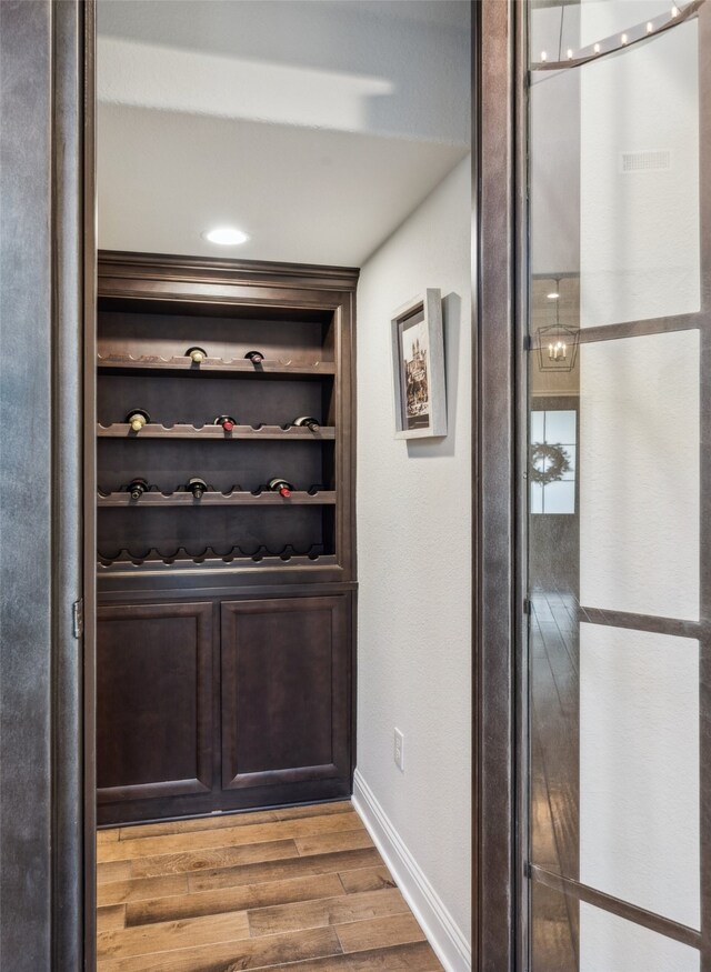 781 Star Meadow Dr, Prosper, TX 75078 - wine cellar with wood finished floors, baseboards, and built in features