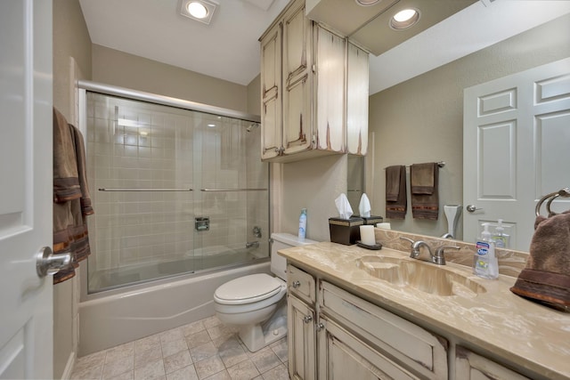 full bathroom featuring toilet, vanity, and enclosed tub / shower combo