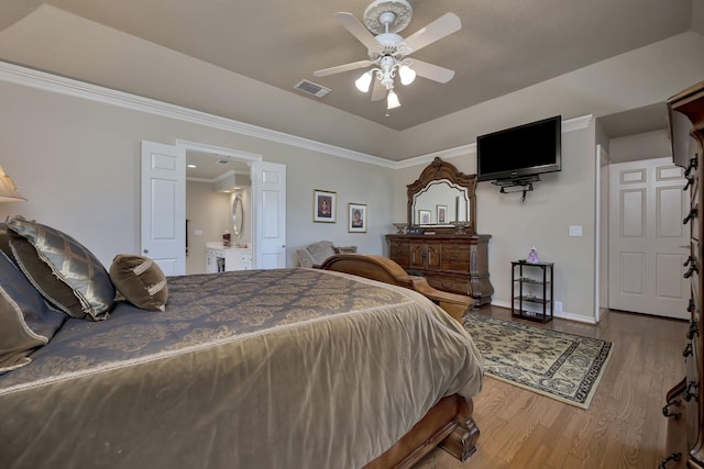 bedroom with visible vents, baseboards, a ceiling fan, crown molding, and wood finished floors