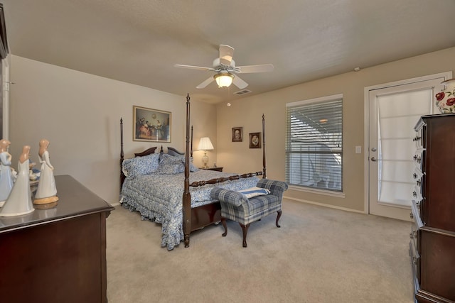 bedroom with light carpet, ceiling fan, baseboards, and visible vents