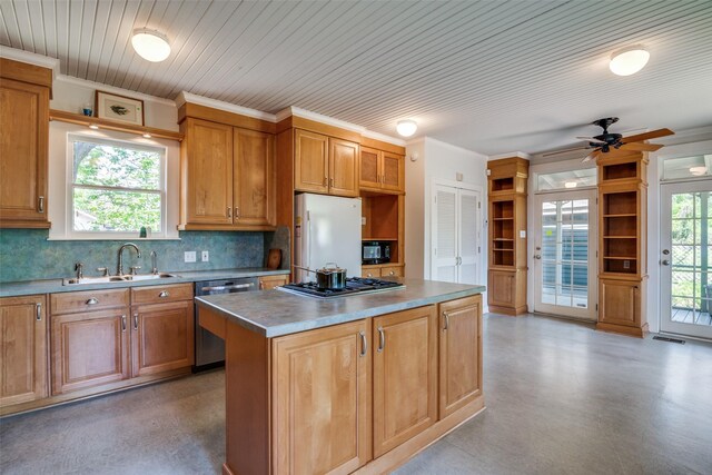 401 Pacific Ave, Terrell, TX 75160 - kitchen featuring tasteful backsplash, a center island, a healthy amount of sunlight, a sink, and stainless steel appliances