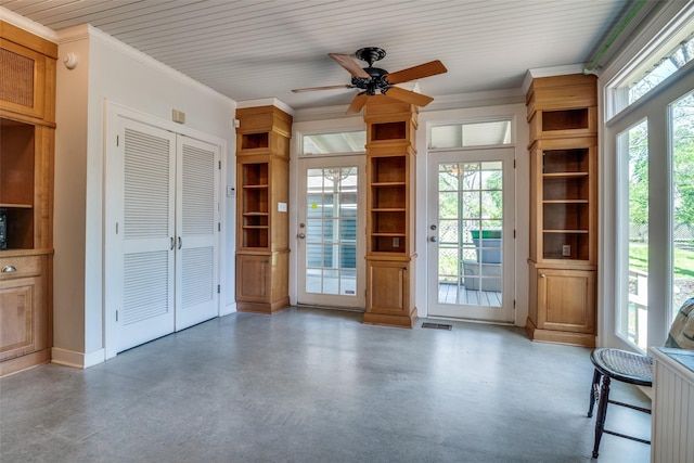 401 Pacific Ave, Terrell, TX 75160 - interior space featuring crown molding, a wealth of natural light, ceiling fan, and concrete flooring