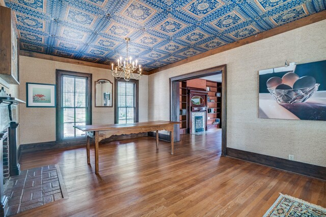 401 Pacific Ave, Terrell, TX 75160 - dining area with an ornate ceiling, a notable chandelier, baseboards, and wood finished floors