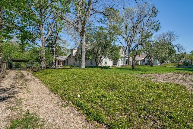 401 Pacific Ave, Terrell, TX 75160 - view of yard with a detached carport and dirt driveway