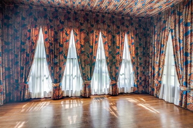 401 Pacific Ave, Terrell, TX 75160 - spare room with visible vents and hardwood / wood-style floors
