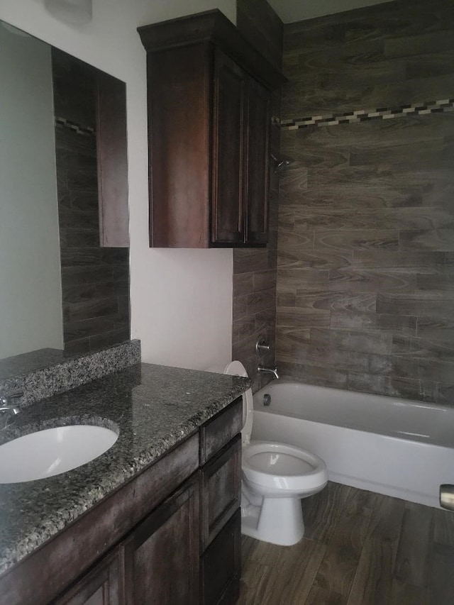 14247 Greenhaw Ln, Dallas, TX 75253 - full bath with washtub / shower combination, toilet, vanity, and wood finished floors