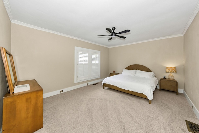 carpeted bedroom featuring crown molding, a ceiling fan, baseboards, and visible vents