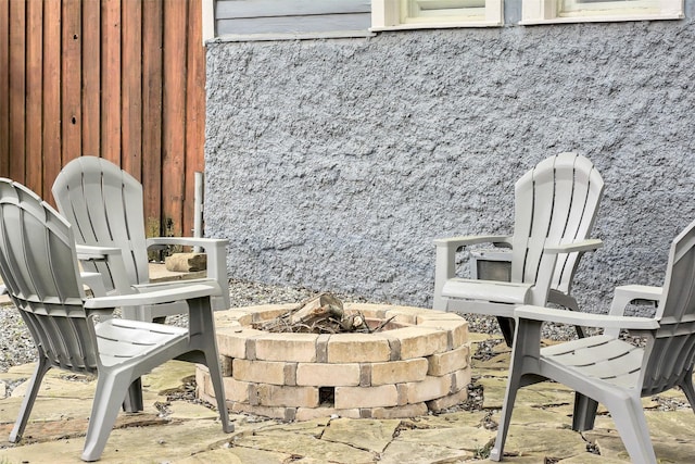 view of patio with an outdoor fire pit