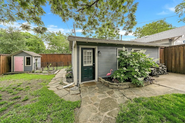 view of shed featuring a fenced backyard