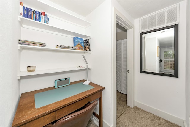 hall featuring baseboards and visible vents