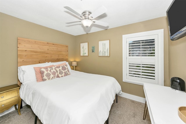 bedroom with carpet floors, a ceiling fan, and baseboards