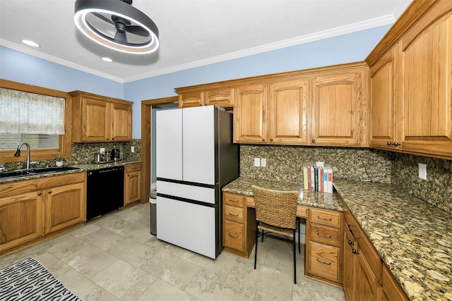 kitchen featuring backsplash, a sink, built in study area, freestanding refrigerator, and black dishwasher