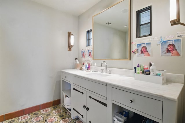 6955 Lakewood Blvd, Dallas, TX 75214 - bathroom featuring vanity, tile patterned flooring, and baseboards