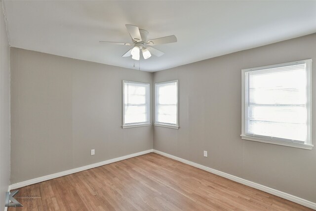 4158 Russell Ave, Abilene, TX 79605 - empty room featuring a wealth of natural light, light wood finished floors, baseboards, and a ceiling fan