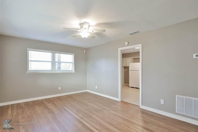 4158 Russell Ave, Abilene, TX 79605 - unfurnished bedroom featuring wood finished floors, freestanding refrigerator, baseboards, and visible vents