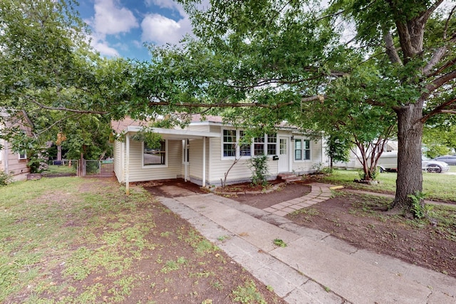 unfurnished sunroom with wooden walls, a healthy amount of sunlight, tile patterned floors, and baseboards