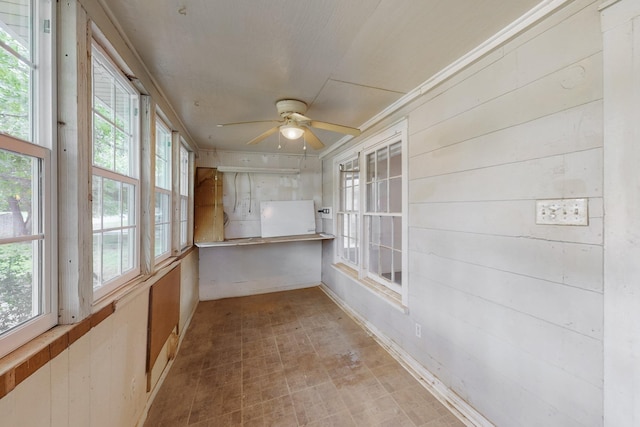 unfurnished room featuring a textured ceiling, baseboards, visible vents, light colored carpet, and a ceiling fan