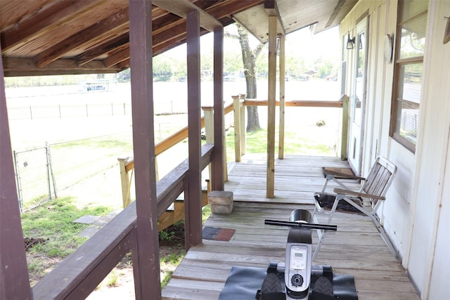 wooden terrace featuring a water view