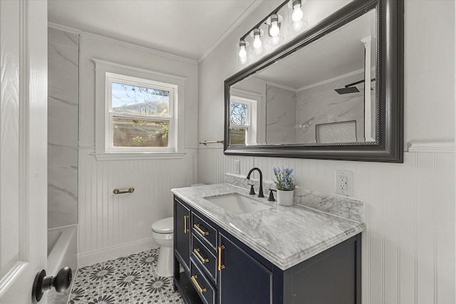 full bath with crown molding, toilet, vanity, and wainscoting