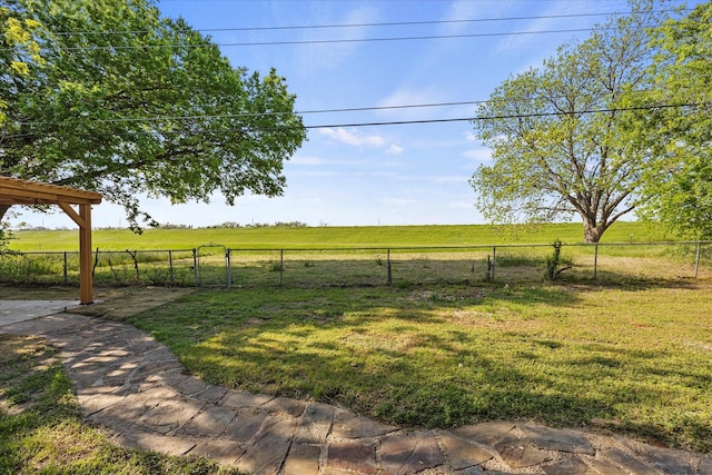 view of yard featuring a fenced backyard and a rural view