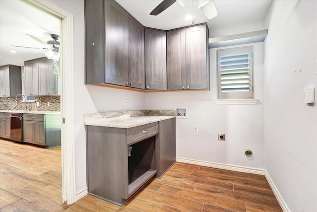 813 Grinnell Dr, Richardson, TX 75081 - laundry room with ceiling fan, hookup for an electric dryer, washer hookup, cabinet space, and light wood finished floors